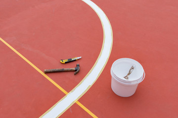 sideline for an outdoor stadium being prepared with tools