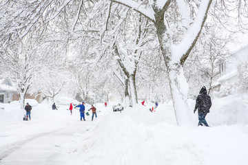 People shoveling out after a large snowstorm