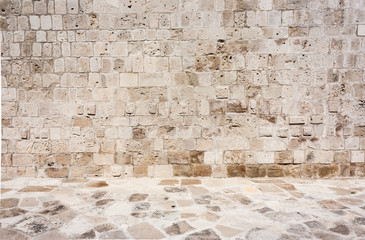 brown, sandy, old wall of a stone house in the open air.Copy space