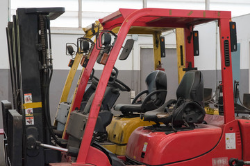 Fototapeta premium Forklifts in warehouse