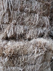 Close-up of Stacked Straw Hay Bails