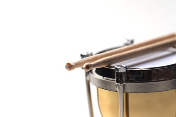 drum and drumsticks isolated on white background
