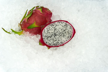 Fototapeta na wymiar Dragon fruit on ice background, sold in supermarkets. Buy for cooking. food concept, copy space.