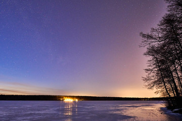 Stars over frozen lake