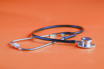 Stethoscope on color background.