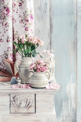 Fototapeta premium Bouquet of pink roses in ceramic vase.