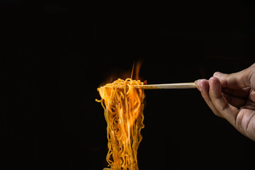 swallowing super spicy noodles wrapped in fire
