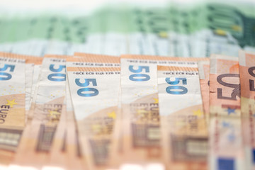 Very large number of Euro banknotes with a shallow depth of field. Concept of winning a lottery or investing big money.