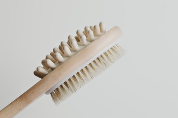 Wooden brush for self massage. Anticellulite treatment. Body peeling and skincare