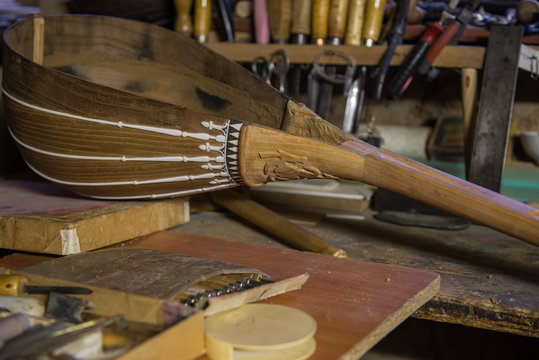 equipment in the workshop for the restoration of ancient musical instruments. wood carving tool