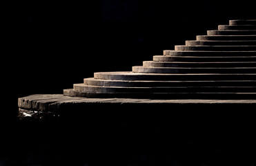 Bright stairs on a black background. 