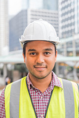 Young civil engineer and construction building background.