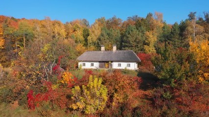Traditional house with thatched roof in Ukrainian village