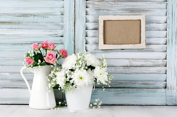 White flowers bouquet against wooden shutters