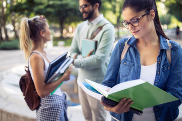 Group of friends studying together at university campus