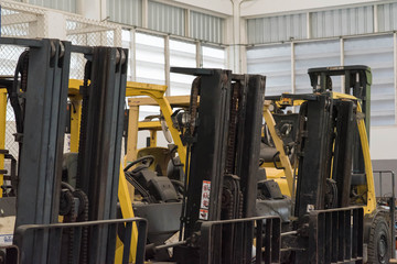 Fototapeta na wymiar Forklifts in warehouse