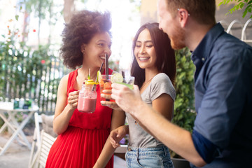 Group of friends having fun together. People talking laughing and enjoying their time