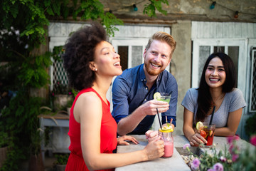 Young friends having a great time together. Group of people talking and smiling.