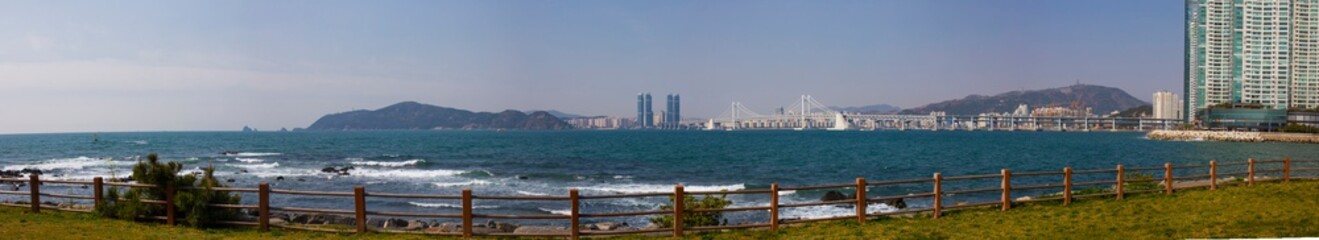 Obraz premium Aerial view of Busan skyline over the sea