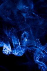 Blue smoke on black background
