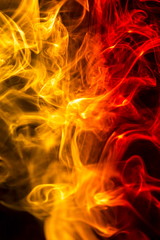 Fototapeta premium Colored smoke on black background