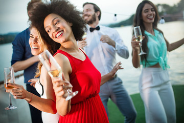 Group of friends having fun and celebrating group gathering