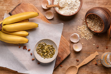 Ingredients for banana bread on wooden table