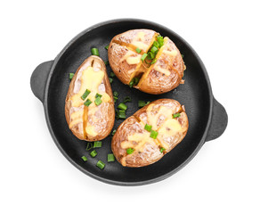 Frying pan with tasty baked potato on white background