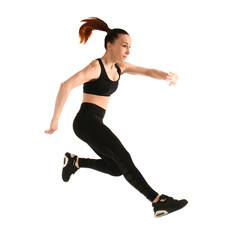 Sporty jumping woman on white background