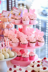 Delicious pink cupcakes on stander