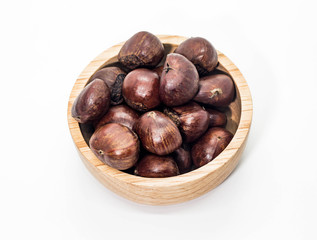 Closeup of brown Chestnuts in the wooden cup