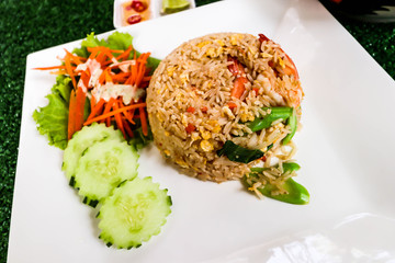 Closeup of fried rice with shrimp on white dish