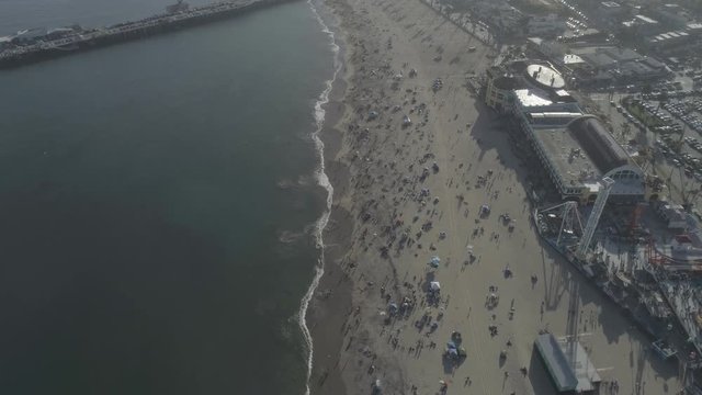AERIAL - People on the Beach next to Beach Boardwalk