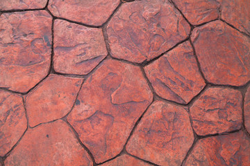 Orange cement floor with trapezoid pattern Small and large, alternately