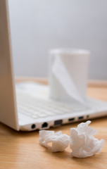 Tissues papers on laptop, symbol of occupational disease or watching porn site