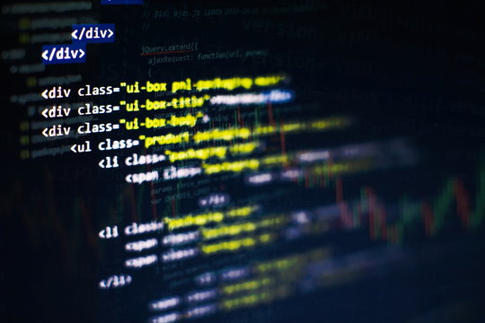 CSS, JavaScript and HTML usage. Monitor closeup of function source code. Abstract IT technology background. Software source code.