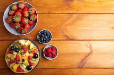 homemade fruit pie on a rustic wooden table top view