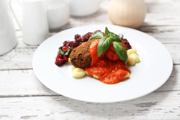 Pumpkin cutlets served with tomato sauce on dumplings on gnocchi, roasted beet salad.