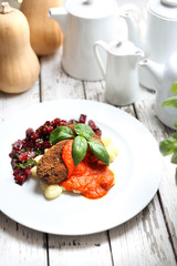 Vegetable cutlets served with tomato sauce on dumplings on gnocchi, roasted beetroot salad.