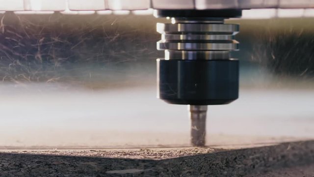 Milling machine cutting the wooden workpiece