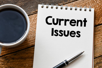 CURRENT ISSUES word on a wooden background. current issues concept