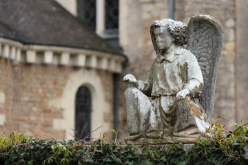 statu of an angel at the saint-pierre abbey in solesmes (france)