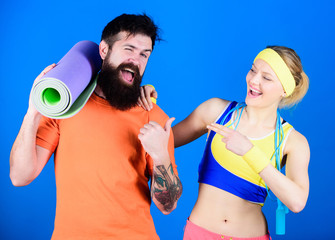 Teamwork Makes The Dream Work. Athletic Success. Sport equipment. Happy woman and bearded man workout in gym. Strong muscles and body. Sporty couple training with fitness mat and skipping rope. Team