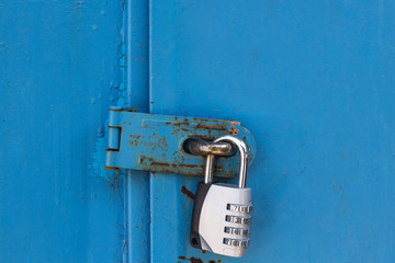 Combination padlock on blue door
