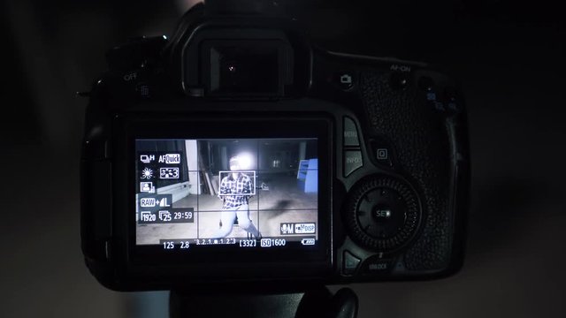 Related young woman hostage with a blindfold through the camera screen
