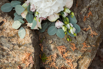 wedding rings on a background of flowers