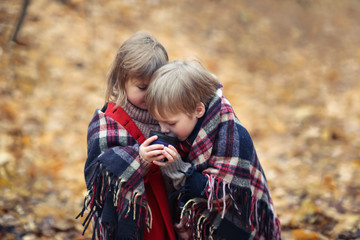 Frozen children autumn forest under blanket, cozy