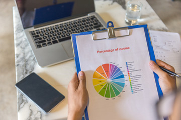 Man reading the financial report of income
