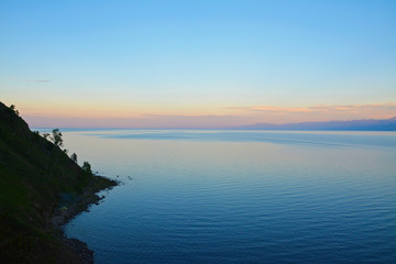 Fototapeta na wymiar Lake Baikal near the village of Angasolka. At Sunset