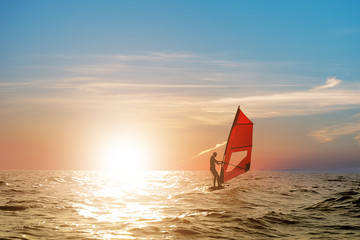 Windsurfing on the sea at sunset. Sunset. Sea